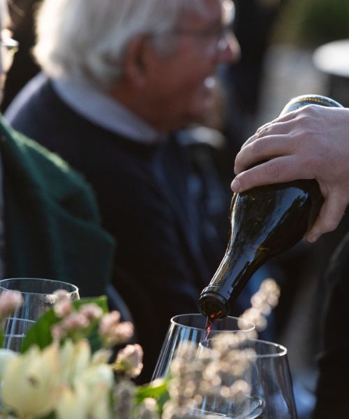 founders Pouring a glass of Mascarin Family Wines at a Founders wine club event
